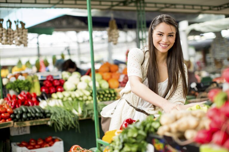 Smiling Young Woman Shopping at the Local Farmer's Market at Elk Ridge | Pittsburgh New Home Connection
