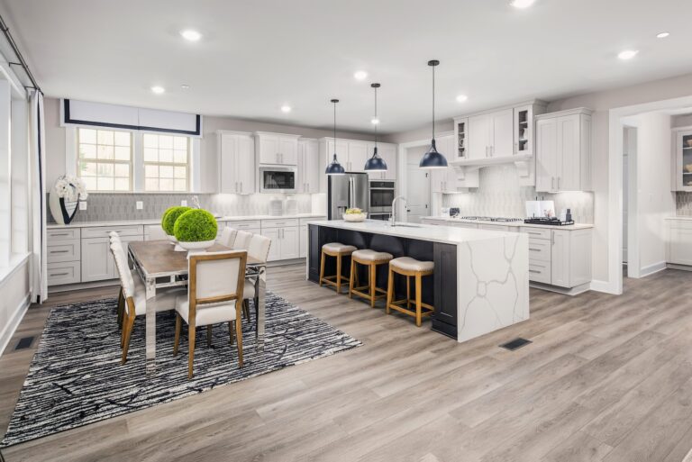 Luxury Eat-in Kitchen with Dining, Bar Stools in White, Neutral Tones, Santorini Model at Pinewood | Pittsburgh New Home Connection