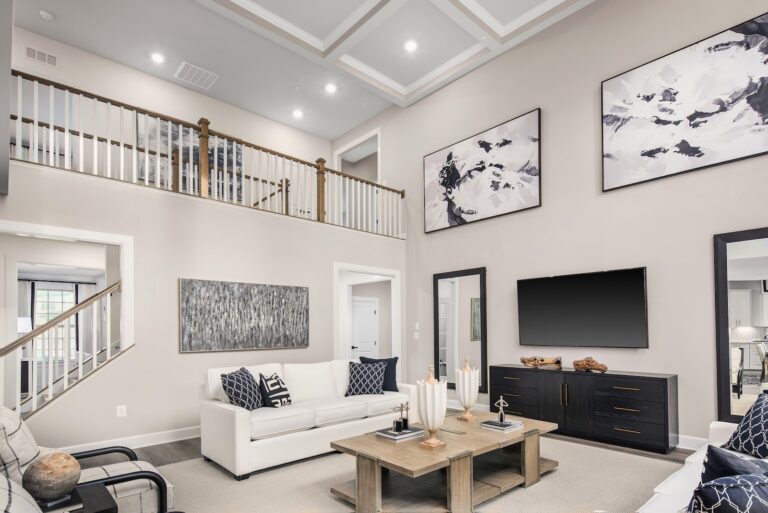 Stunning, Expansive Living Downstairs Area with High Ceilings in Neutral Tones, Modern Art - Santorini Model at Pinewood | Pittsburgh New Home Connection