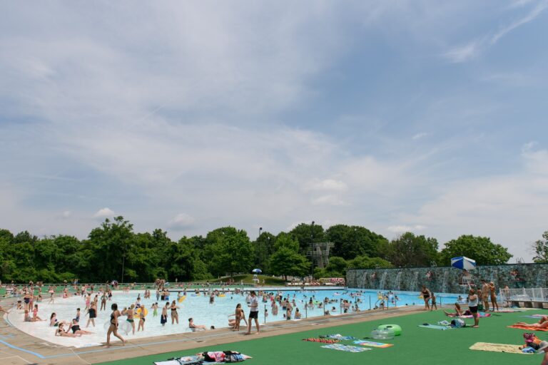 Crowded Outdoor Pool with Cascading Water Features at Settlers Cabin Park Near Scenic Ridge | Pittsburgh New Home Connection
